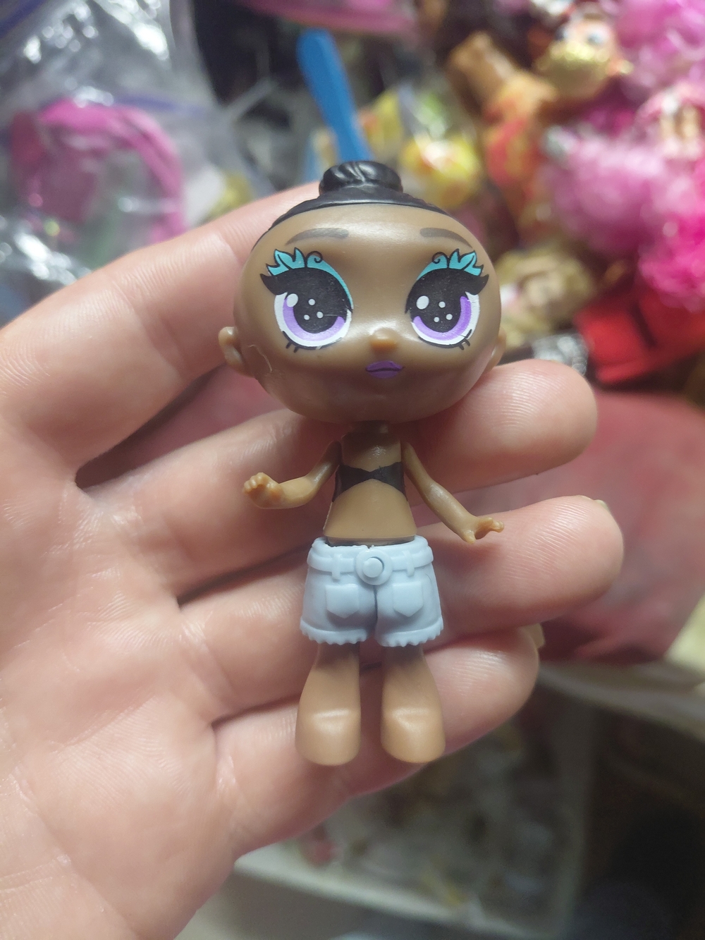 small Skyrocket Blume surprise doll missing its squishy, removable hair.